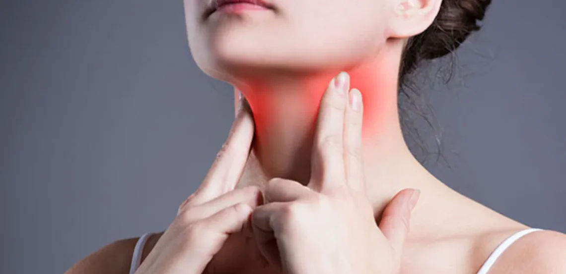 Woman-experiencing-thyroid-pain-and-neck-discomfort